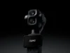 A DJI teaser render showing the Osmo Pocket 4P dual-camera gimbal