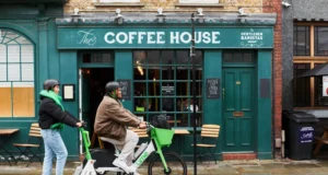 Lime Files for IPO as Shared Scooters Try to Grow Up Two Lime riders using an electric scooter and e-bike outside a coffee shop