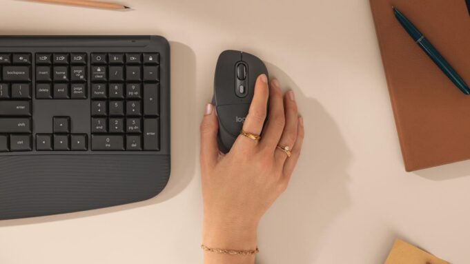 Logitech’s Signature Comfort Plus Line Adds a Palm Cushion for Your Wrist A hand resting on the Logitech Signature Comfort Plus M850 L mouse next to the keyboard