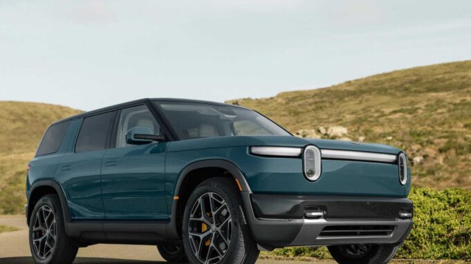 Rivian R2 Lands June 9: Orders, Demo Drives, and First Deliveries Rivian R2 electric SUV in blue parked on a coastal road