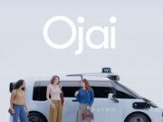Waymo Ojai robotaxi official exterior image with riders standing beside the vehicle