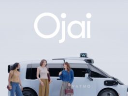 Waymo Ojai robotaxi official exterior image with riders standing beside the vehicle