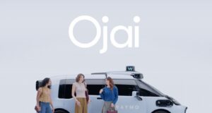Waymo Ojai robotaxi official exterior image with riders standing beside the vehicle