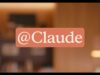 Anthropic official Claude Tag announcement graphic showing the @Claude tag over a warm office setting.