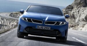 The new BMW i3 50 xDrive First Edition electric sedan shown in a front-profile shot.