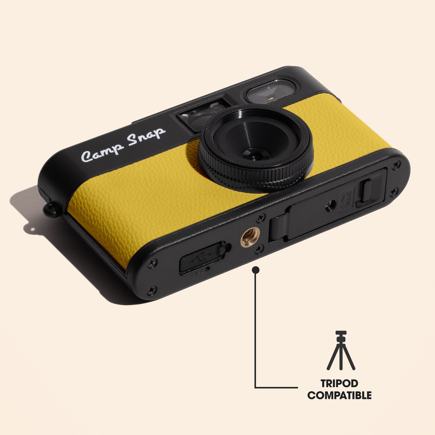 Yellow Camp Snap 2 camera showing the tripod-compatible mounting point.
