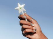 Cash App Wand NFC payment accessory held in a hand
