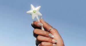 Cash App Wand NFC payment accessory held in a hand