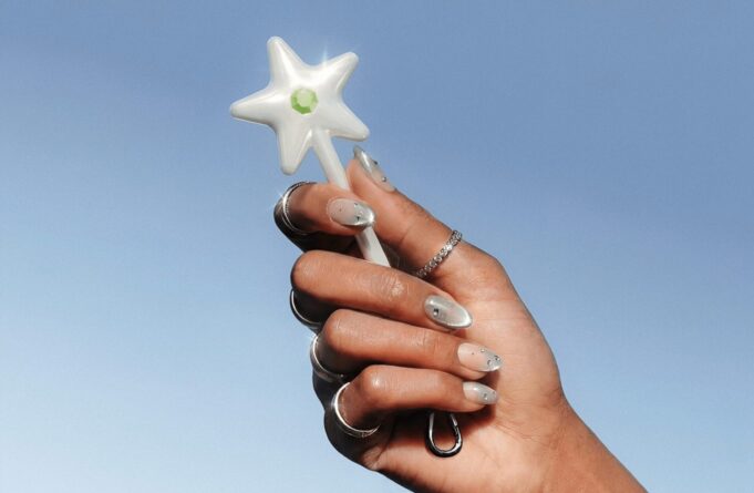 Cash App Wand NFC payment accessory held in a hand