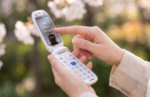 Commodore’s Callback 8020 Is A Retro Flip Phone With Modern App Tricks Commodore Callback 8020 flip phone open in a person's hand.