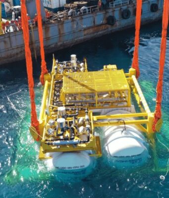 Hailanyun underwater data center module being lowered into the sea from a barge