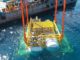 China Switches On the World’s First Wind-Powered Underwater Data Center Hailanyun underwater data center module being lowered into the sea from a barge