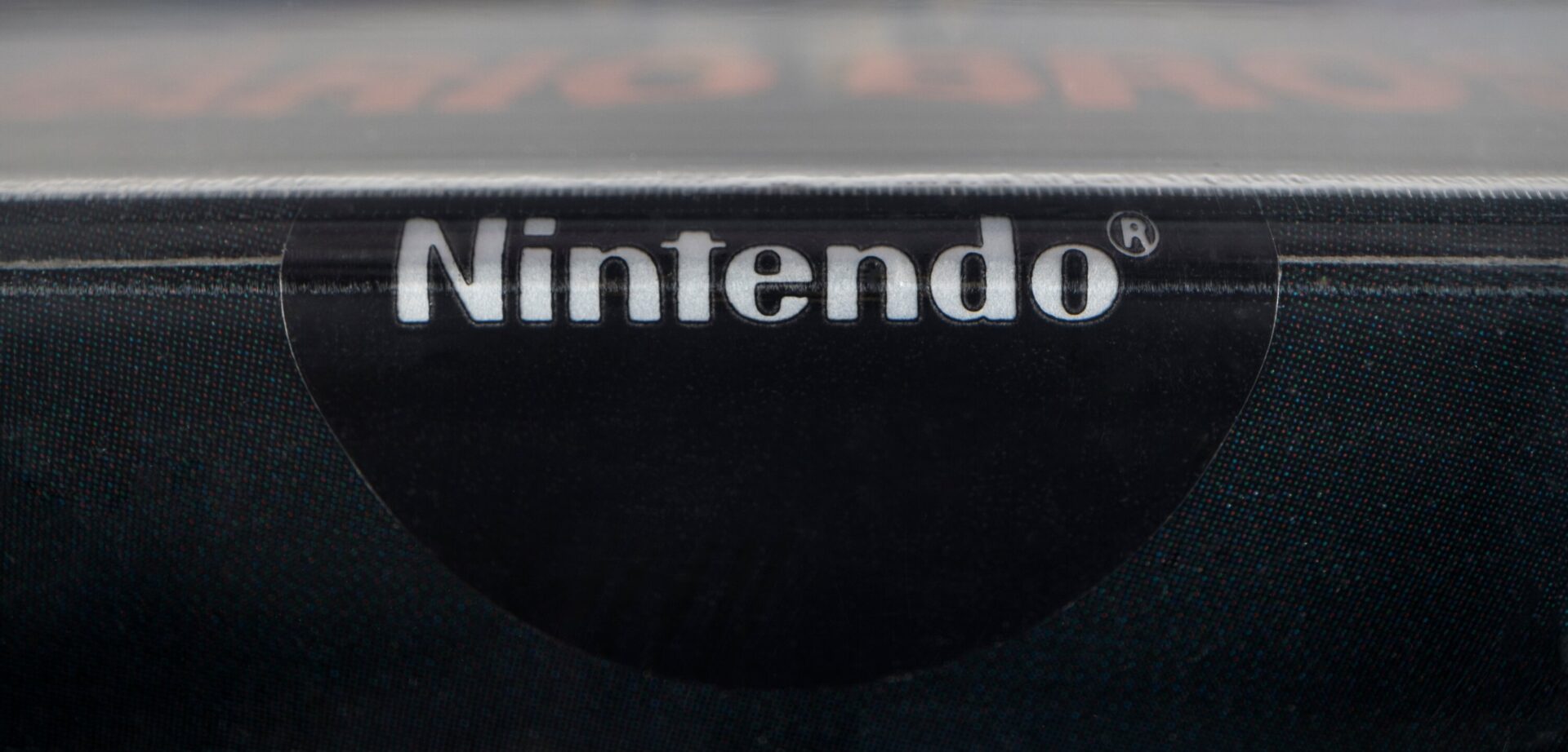 Close-up of the Nintendo gloss sticker seal on the sealed Super Mario Bros. auction copy