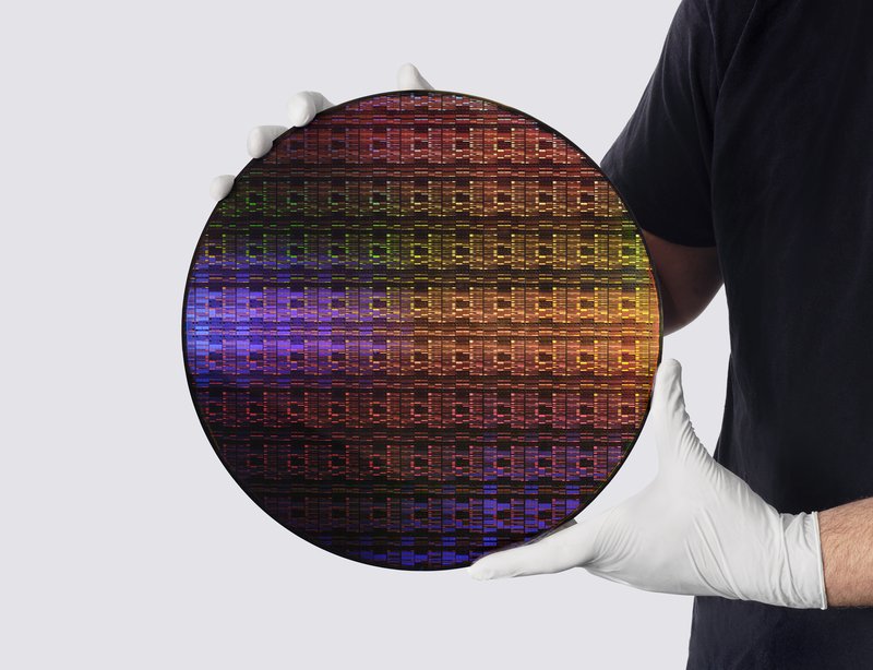 IBM researcher holding the sub-1 nanometer node wafer