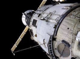International Space Station Zvezda service module with a Progress spacecraft docked nearby