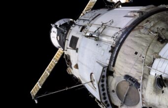 NASA Briefly Sent ISS Astronauts Into Dragon During Russian Module Leak Scare International Space Station Zvezda service module with a Progress spacecraft docked nearby
