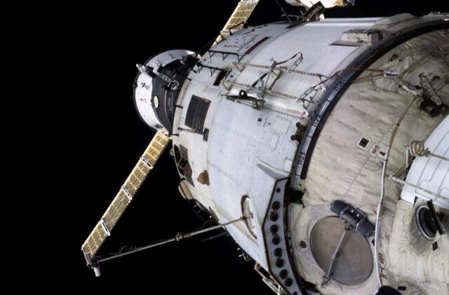 International Space Station Zvezda service module with a Progress spacecraft docked nearby