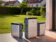Jackery Ark AI EMS home energy hardware shown outside a house.