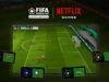 Illustration of Netflix Games' FIFA World Cup game on a tv screen, showing four floating smartphones acting as controllers.
