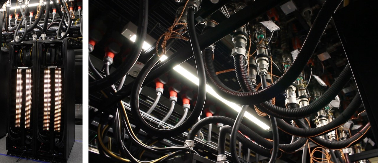 Close-up of NVIDIA liquid cooling hoses and connectors feeding data center racks