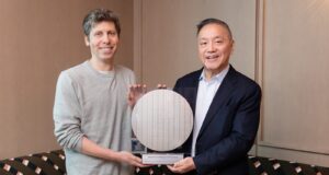 Sam Altman and Broadcom president Hock Tan holding the OpenAI Jalapeno inference chip wafer