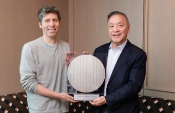 Sam Altman and Broadcom president Hock Tan holding the OpenAI Jalapeno inference chip wafer