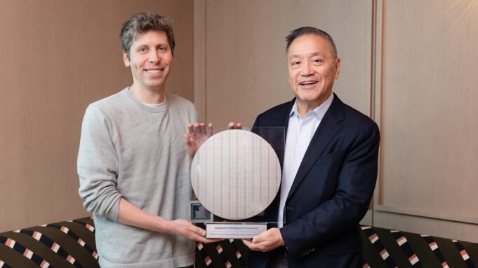 Sam Altman and Broadcom president Hock Tan holding the OpenAI Jalapeno inference chip wafer