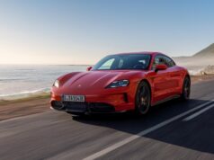 2027 Porsche Taycan Adds Fake Gears That Are Meant To Feel Real Red Porsche Taycan driving on a coastal road.