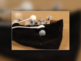 RHA MA450i aluminium earphones on the included RHA carry pouch