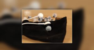 RHA MA450i aluminium earphones on the included RHA carry pouch