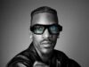 Model wearing Snap Specs AR glasses in an official black-and-white product portrait.