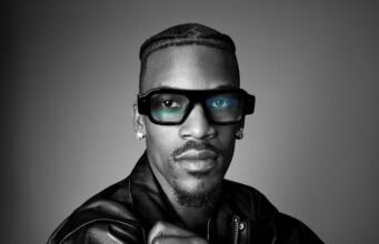 Snap Specs Turn AR Glasses Into a $2,195 Public Bet Model wearing Snap Specs AR glasses in an official black-and-white product portrait.