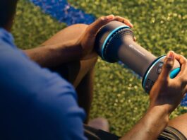 Therabody CryoTherm Palm handheld recovery device being used