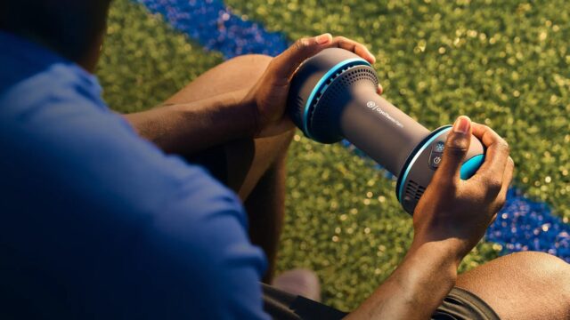 Therabody CryoTherm Palm Recovery Tool Therabody CryoTherm Palm handheld recovery device being used