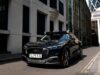 Uber Wayve robotaxi on a London street with autonomous driving sensors on the roof