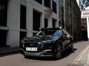 Uber Wayve robotaxi on a London street with autonomous driving sensors on the roof