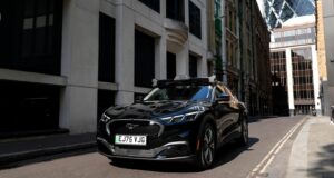 Uber Wayve robotaxi on a London street with autonomous driving sensors on the roof