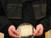 Water-harvesting jacket prototype with hydrogel panels and a fabric sample at UT Austin