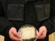Water-harvesting jacket prototype with hydrogel panels and a fabric sample at UT Austin