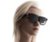 Woman wearing XREAL Aura Android XR glasses in a close-up official XREAL product image.