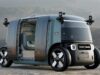 Zoox robotaxi with open doors showing the updated production-intent design