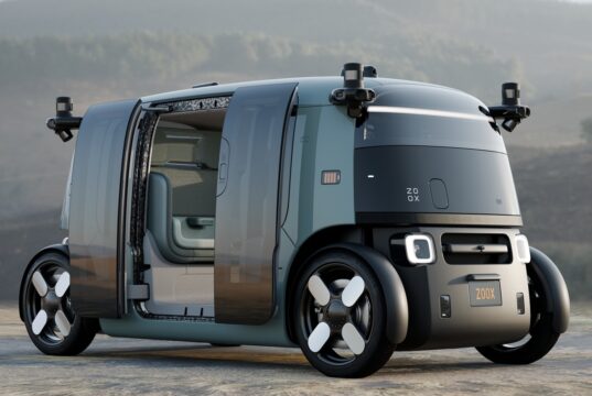 Zoox robotaxi with open doors showing the updated production-intent design