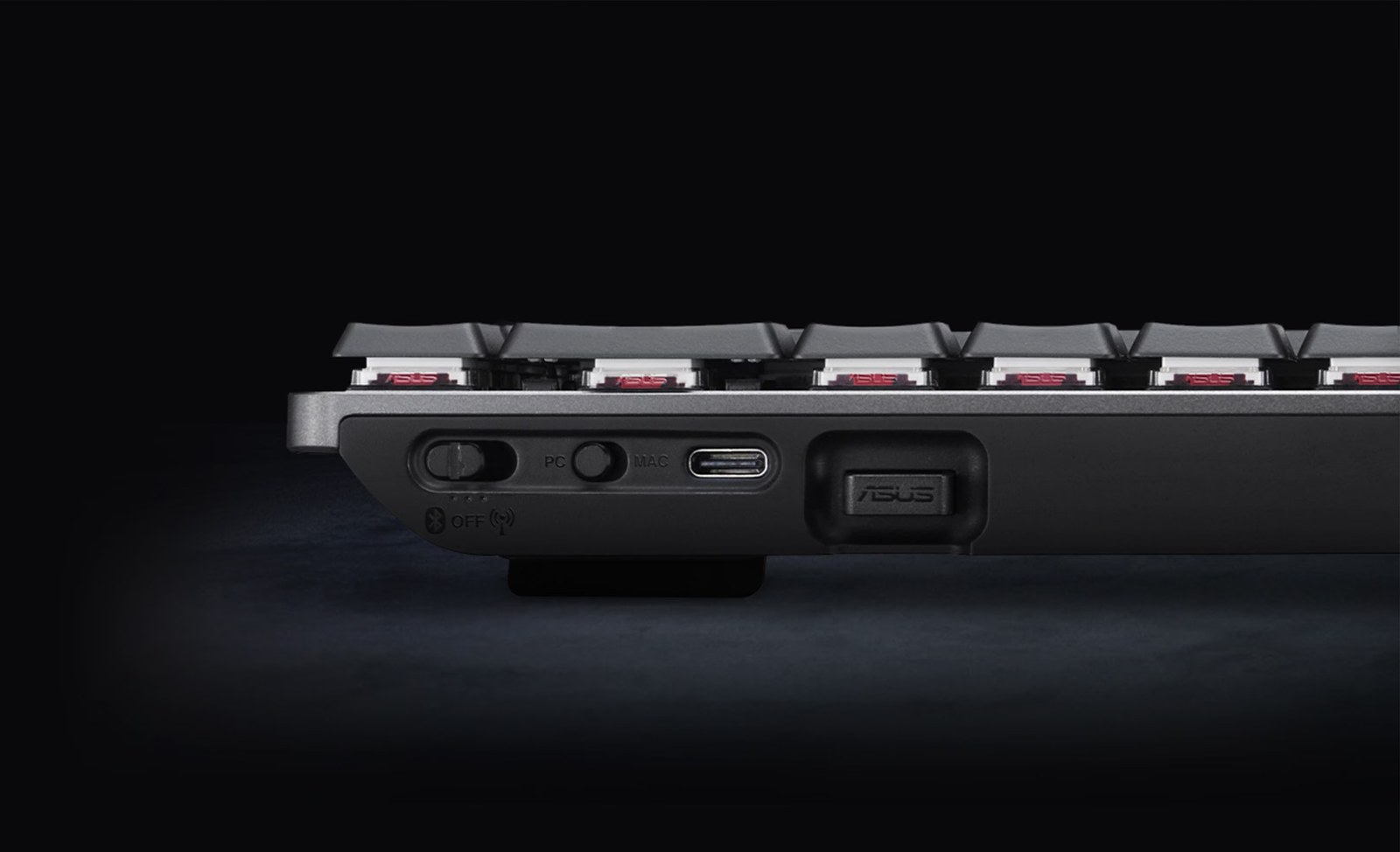 Close-up of the ProArt Keyboard KD300 showing its OS switch, USB-C port, and low-profile optical switches