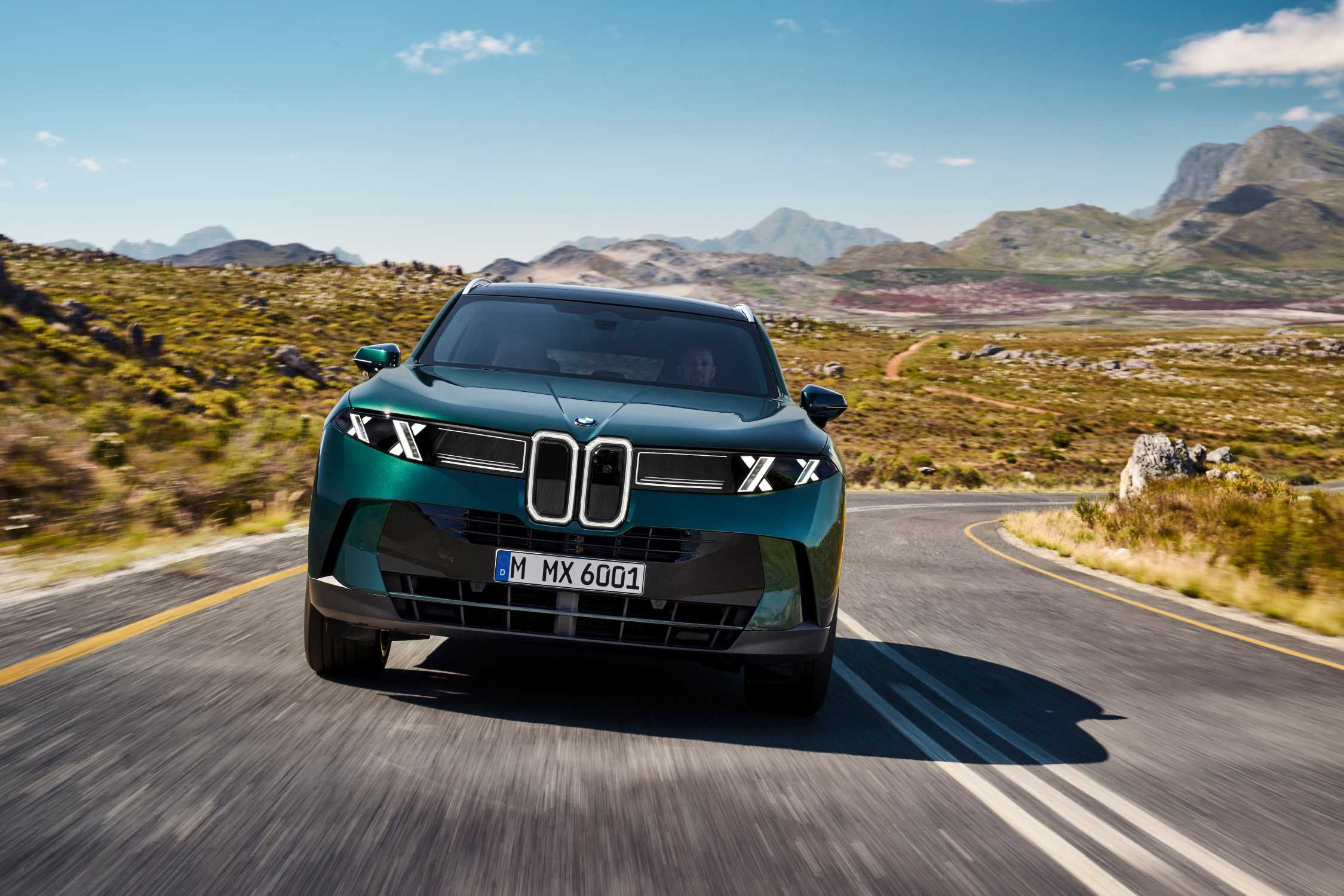 BMW iX5 front view showing the double-X light signature in an official BMW press image