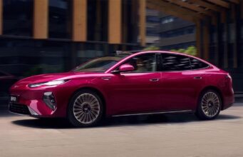 BYD Seal 08 Launches in China at $13,500 Less Than a Comparable Model 3 BYD Seal 08 sedan in magenta finish, side profile driving through a city street