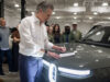 California EV Rebate: MyFirstEV Offers $3,500 to New Buyers California EV rebate announcement with Gov. Gavin Newsom signing legislation beside a Rivian vehicle