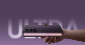 Samsung Galaxy Z Fold8 Ultra held in hand showing triple camera and open foldable display