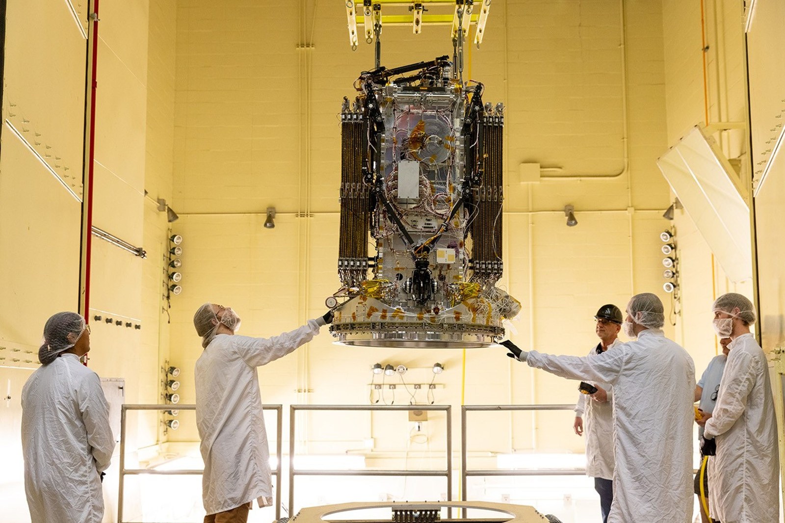 Engineers from Katalyst Space Technologies stabilize the LINK robotic servicing spacecraft during vibration testing