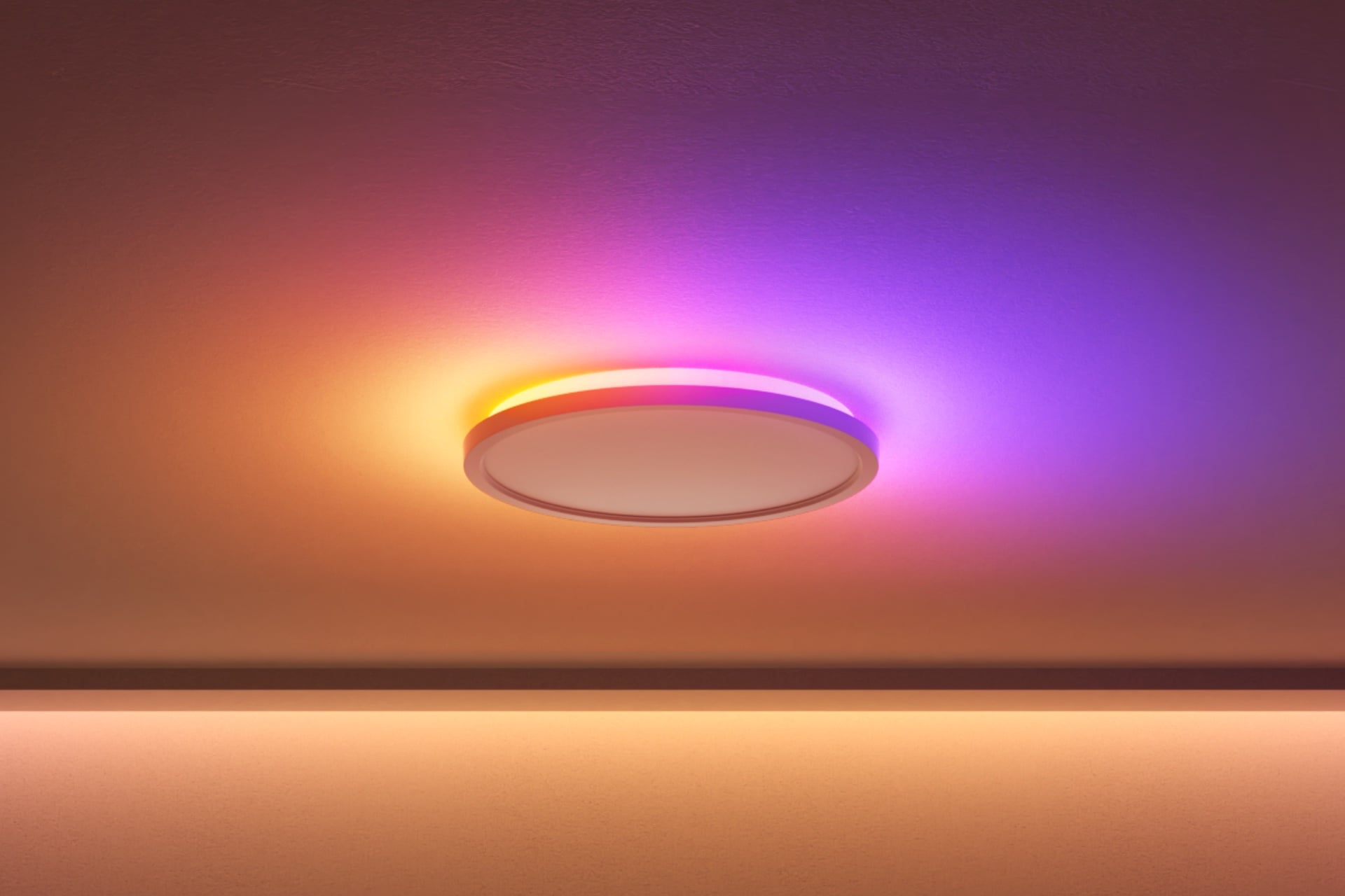Nanoleaf Smart Multicolor Ceiling Light showing vibrant yellow and purple ambient backlighting