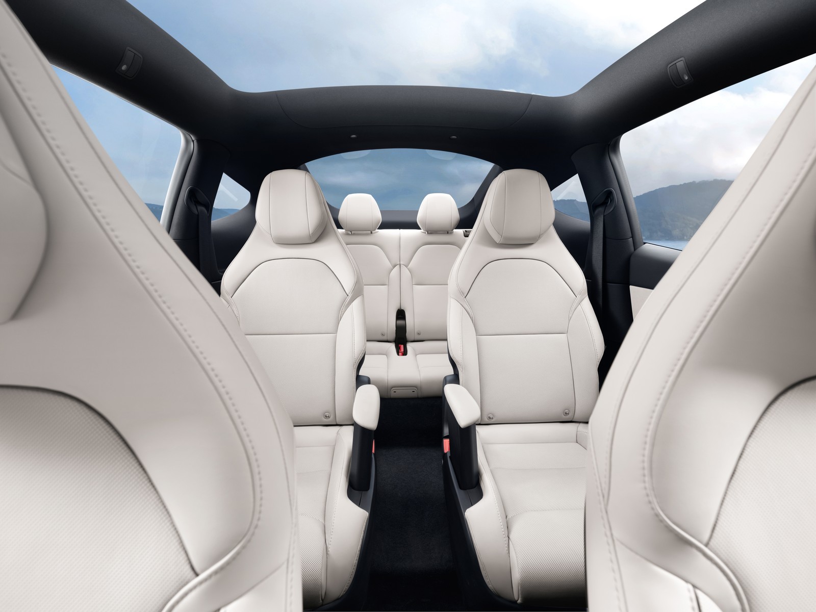Tesla Model Y Long Wheelbase three-row interior with six white seats and second-row captain's chairs